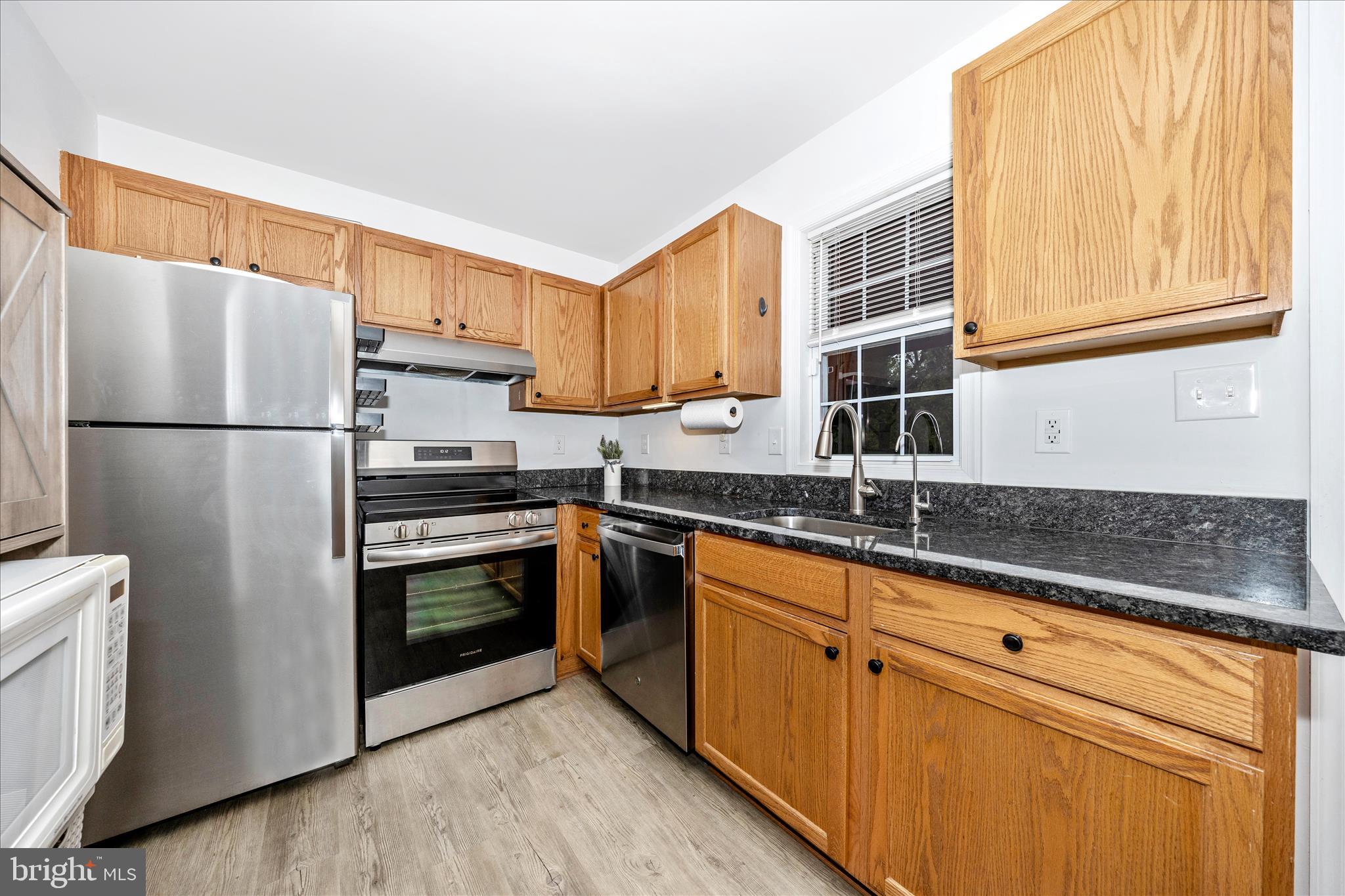 916 Harwood Road Hagerstown, MD 21740 - Photo 20 of 52 a kitchen with stainless steel appliances granite countertop a refrigerator sink and stove