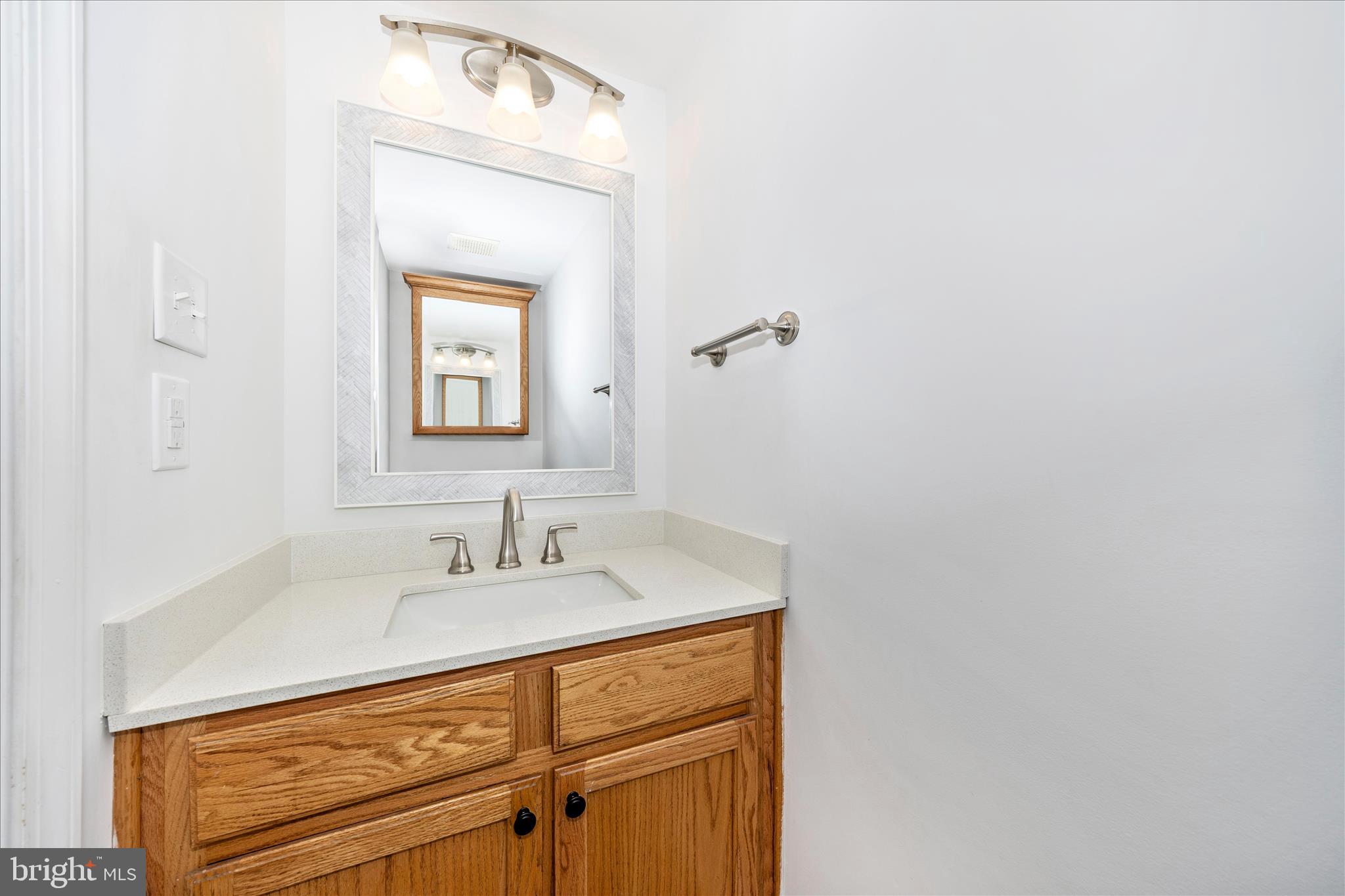 916 Harwood Road Hagerstown, MD 21740 - Photo 21 of 52 a bathroom with a sink and a mirror