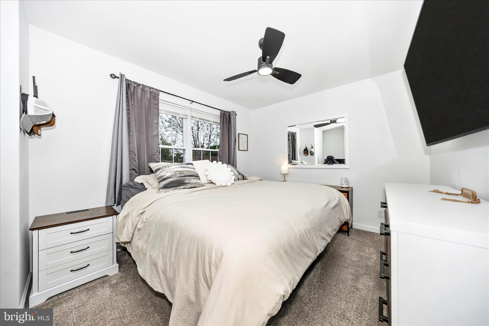 916 Harwood Road Hagerstown, MD 21740 - Photo 25 of 52 a bedroom with a bed and a flat tv screen