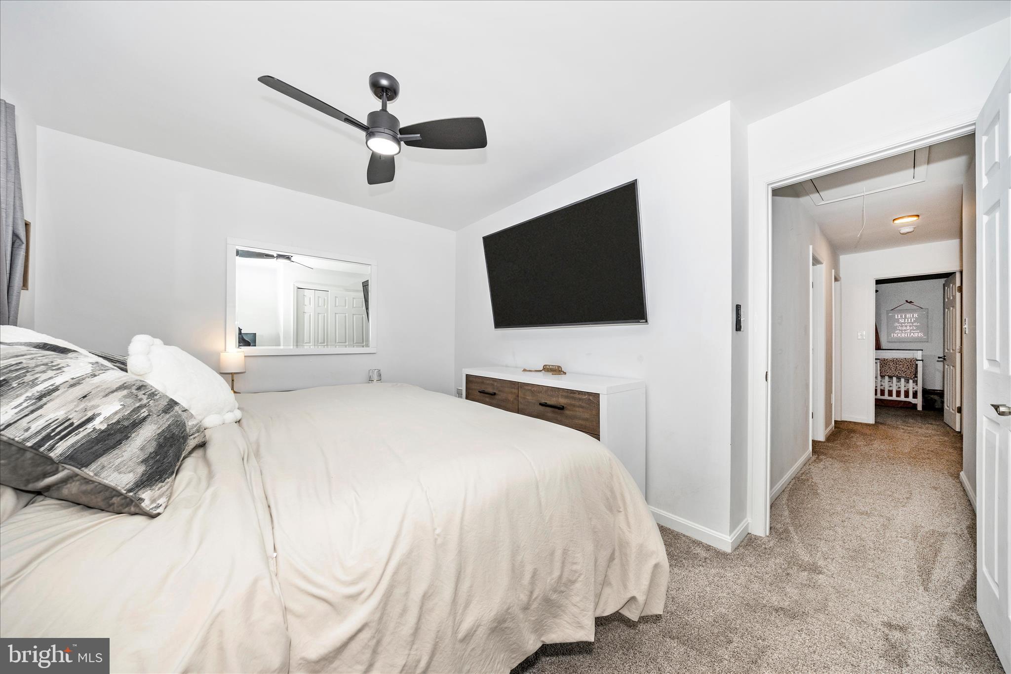 916 Harwood Road Hagerstown, MD 21740 - Photo 26 of 52 a bedroom with a bed and a flat screen tv
