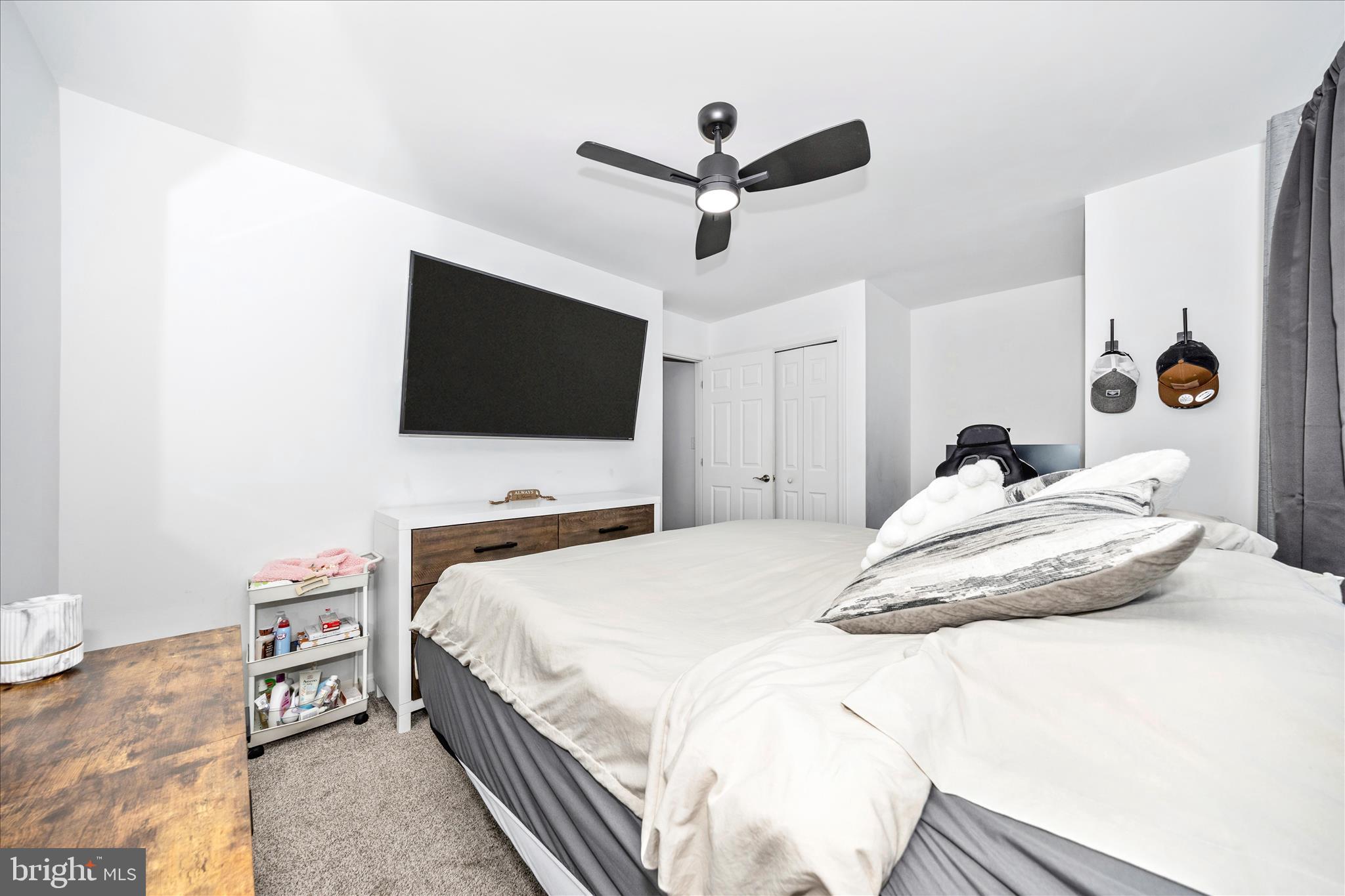916 Harwood Road Hagerstown, MD 21740 - Photo 27 of 52 a bedroom with a bed and a flat screen tv