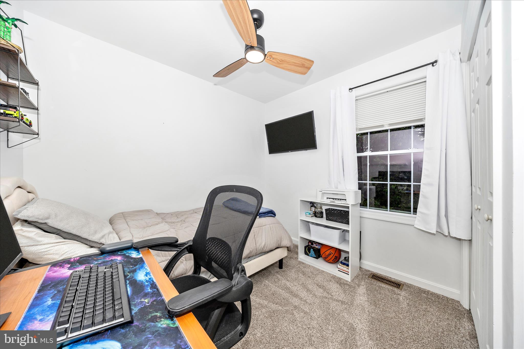 916 Harwood Road Hagerstown, MD 21740 - Photo 29 of 52 a living room with furniture and a flat screen tv