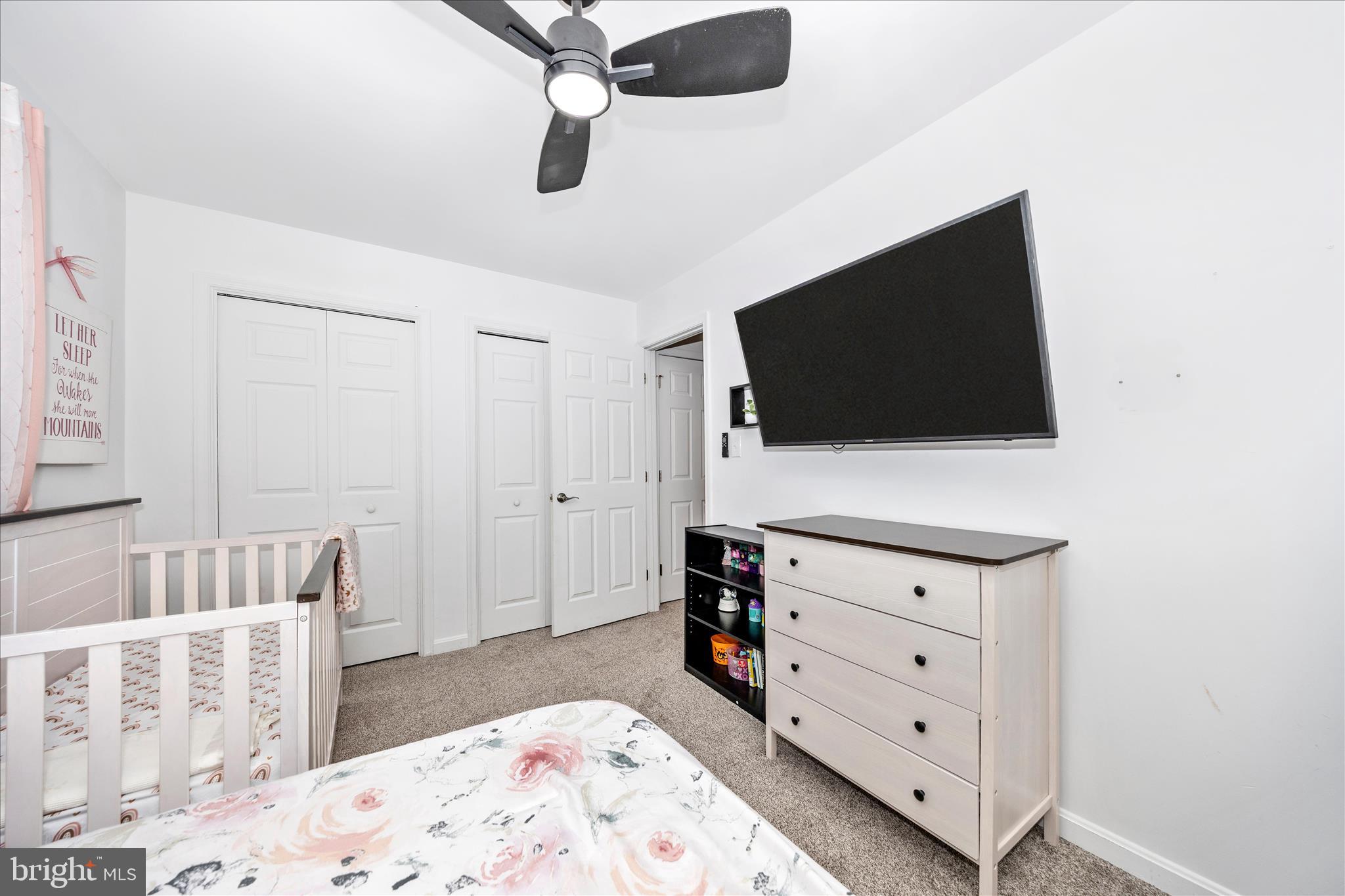 916 Harwood Road Hagerstown, MD 21740 - Photo 35 of 52 a view of a bedroom with a flat tv screen and dresser