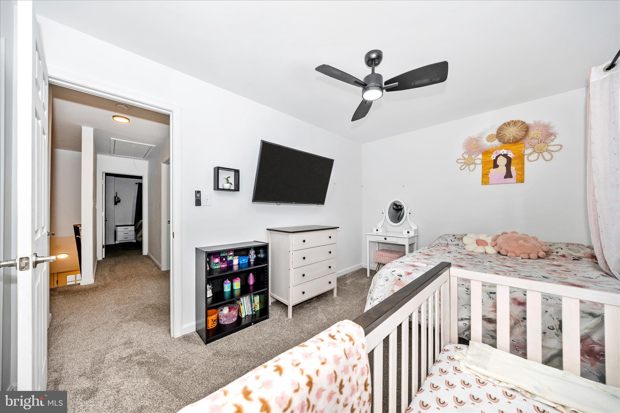 916 Harwood Road Hagerstown, MD 21740 - Photo 36 of 52 a bedroom with furniture and a flat screen tv