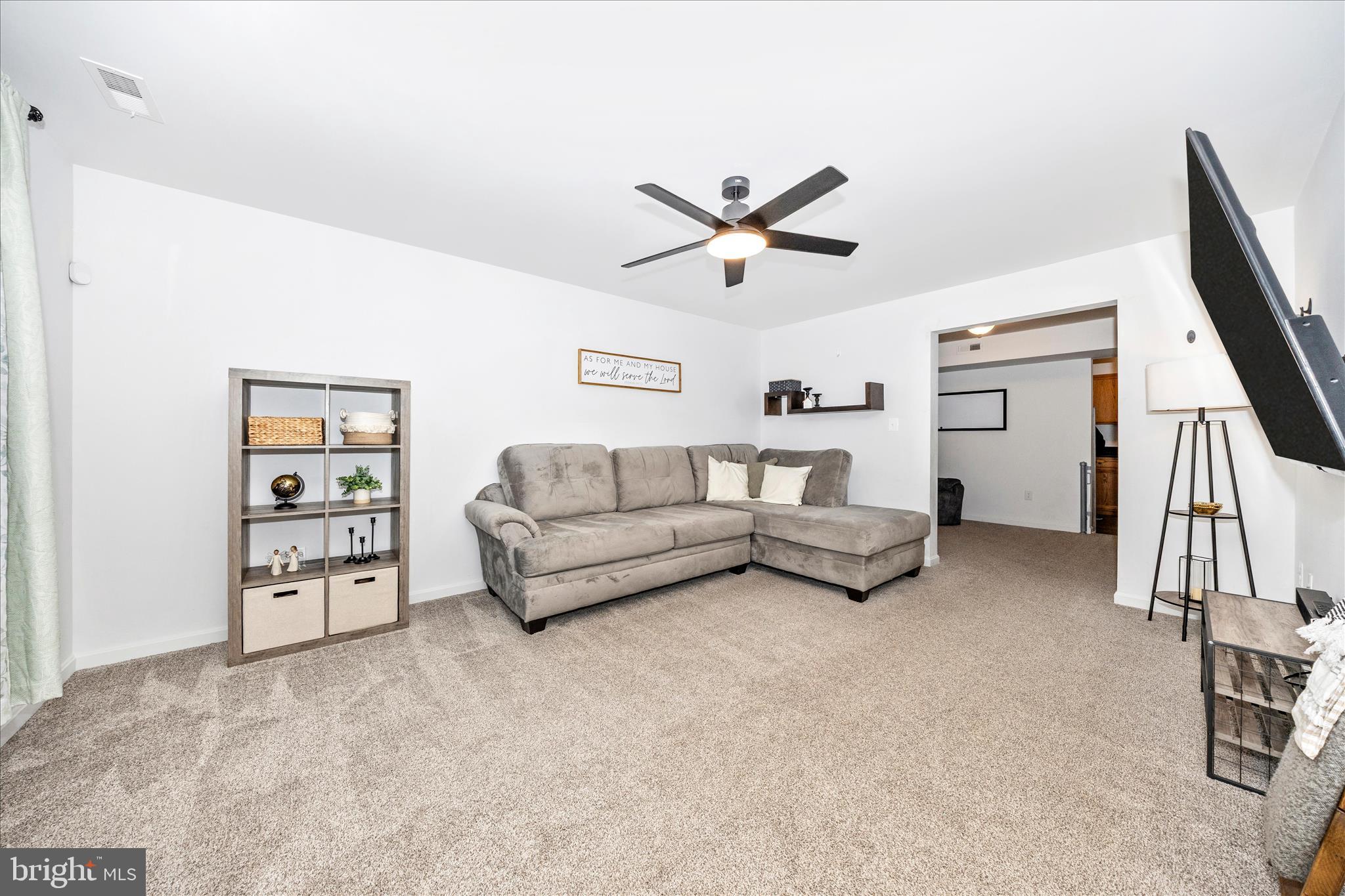 916 Harwood Road Hagerstown, MD 21740 - Photo 4 of 52 a living room with furniture a ceiling fan and a window