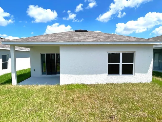 a view of front door and yard