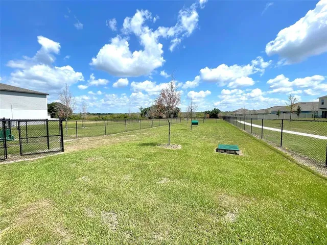 a view of a golf course with a swimming pool