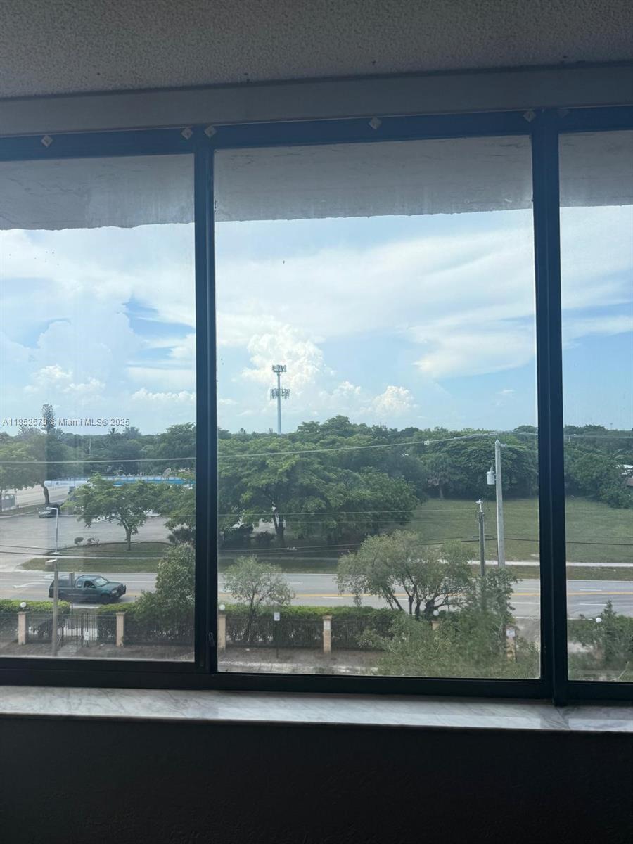 8040 Hampton Boulevard, Unit 512 North Lauderdale, FL 33068 - Photo 16 of 18 a view of a glass door and from window
