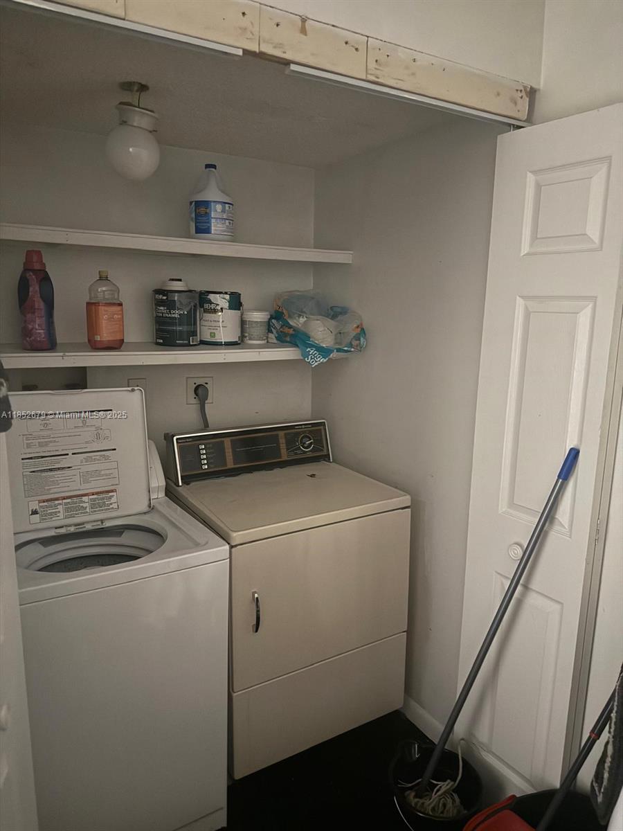 8040 Hampton Boulevard, Unit 512 North Lauderdale, FL 33068 - Photo 17 of 18 a utility room with dryer and washer