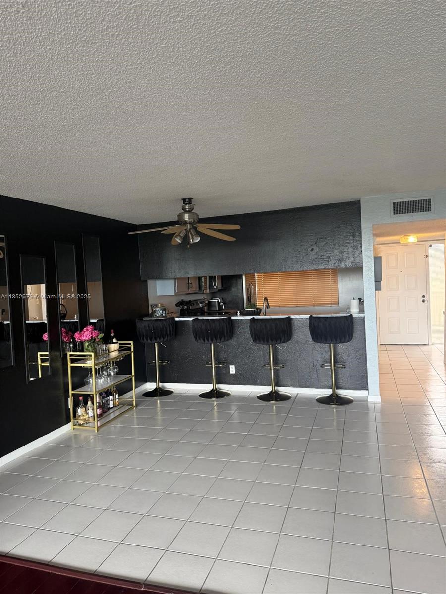 8040 Hampton Boulevard, Unit 512 North Lauderdale, FL 33068 - Photo 4 of 18 an empty room with gym equipment