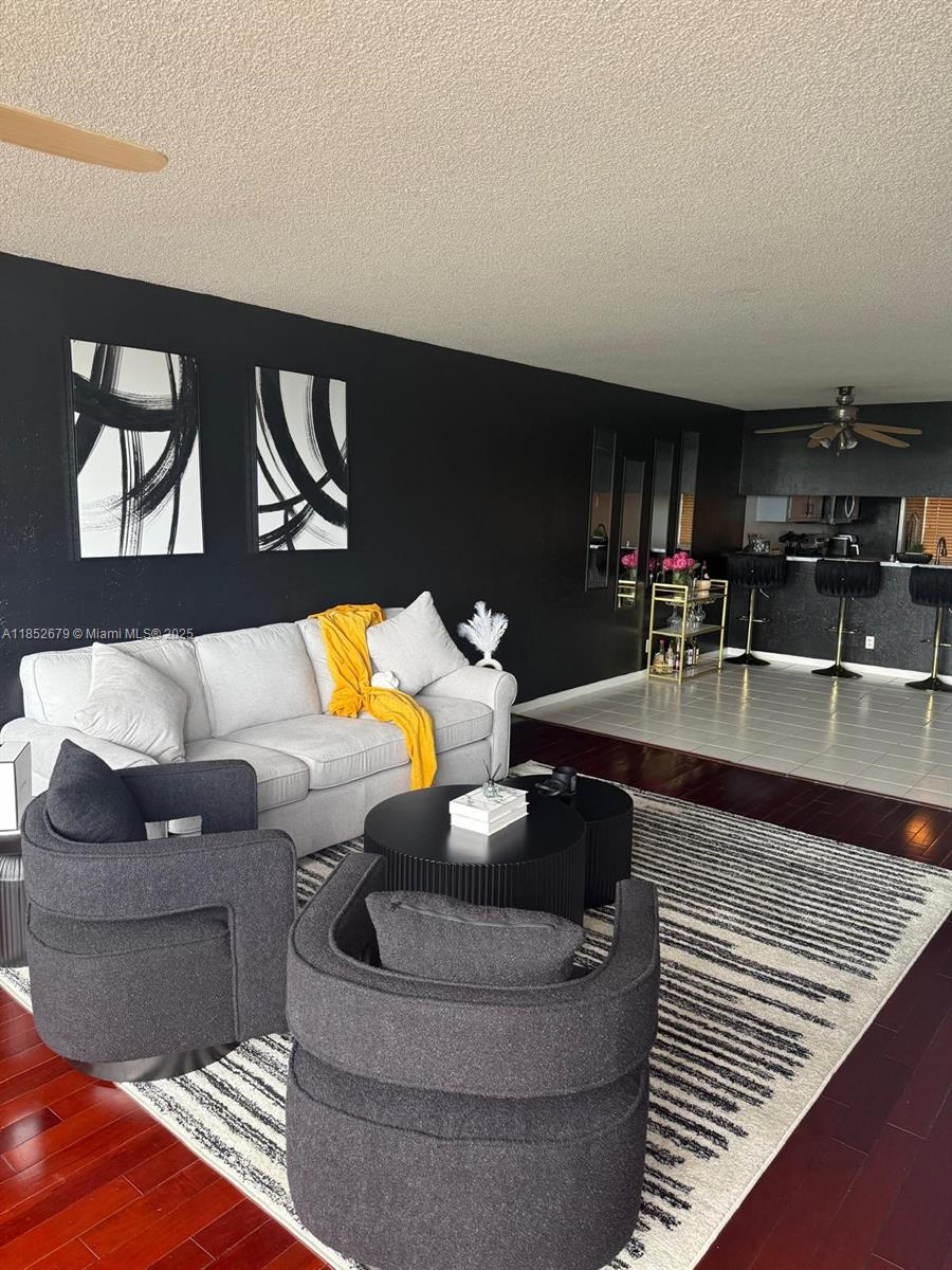 8040 Hampton Boulevard, Unit 512 North Lauderdale, FL 33068 - Photo 8 of 18 a living room with furniture and a fireplace