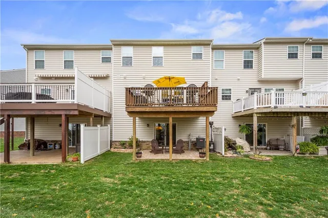 a view of a building with a backyard