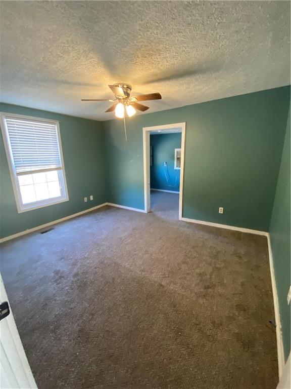 140 Line Street Buford, GA 30518 - Photo 11 of 31 an empty room with windows and closet