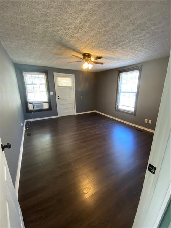 140 Line Street Buford, GA 30518 - Photo 13 of 31 an empty room with wooden floor and windows