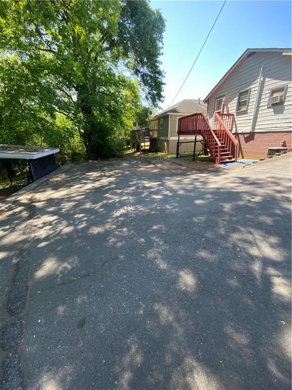 140 Line Street Buford, GA 30518 - Photo 15 of 31 a view of a house with a yard