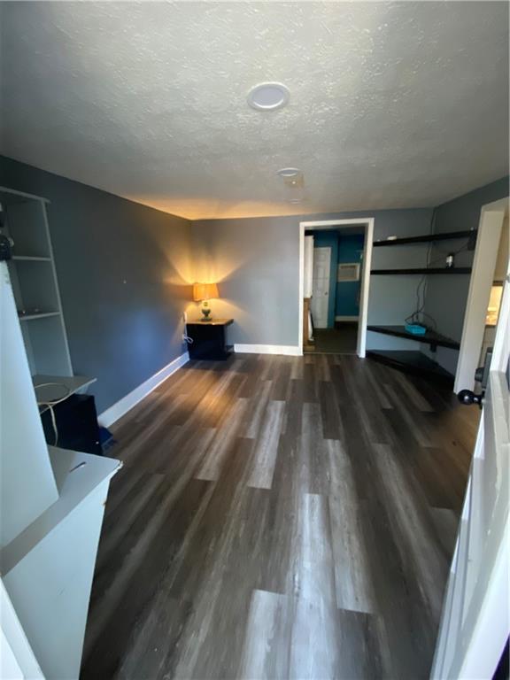140 Line Street Buford, GA 30518 - Photo 18 of 31 a view of an empty room with wooden floor and a window