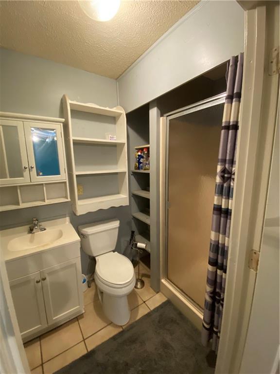 140 Line Street Buford, GA 30518 - Photo 20 of 31 a bathroom with a toilet a sink and shower