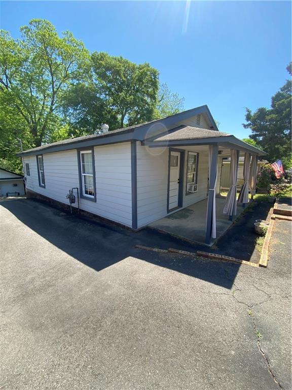 140 Line Street Buford, GA 30518 - Photo 2 of 31 a front view of a house with a yard