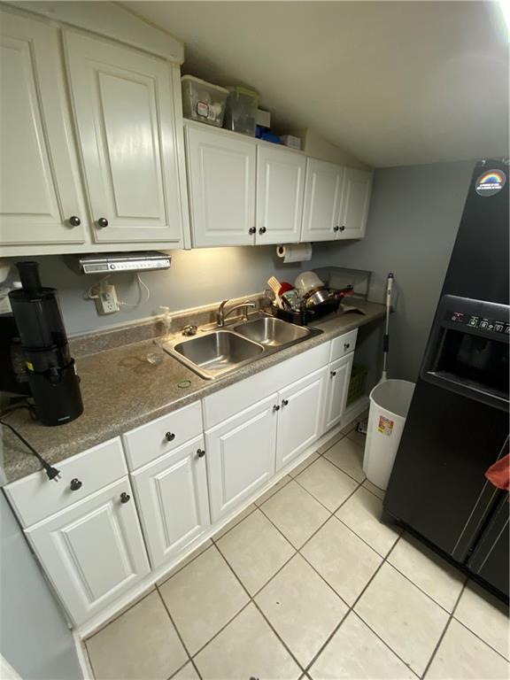 140 Line Street Buford, GA 30518 - Photo 22 of 31 a kitchen with a sink and cabinets