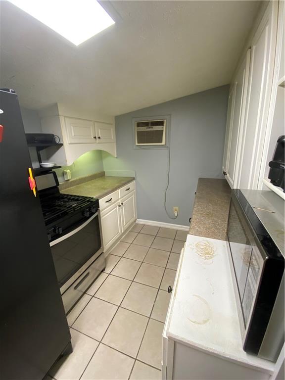 140 Line Street Buford, GA 30518 - Photo 23 of 31 a kitchen with a sink a stove and cabinets