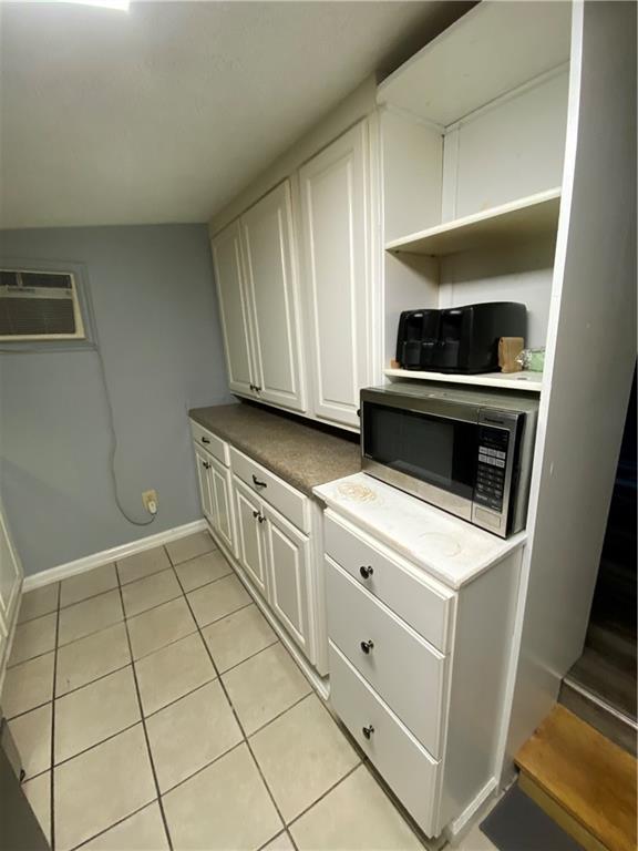 140 Line Street Buford, GA 30518 - Photo 24 of 31 a kitchen with cabinets and appliances