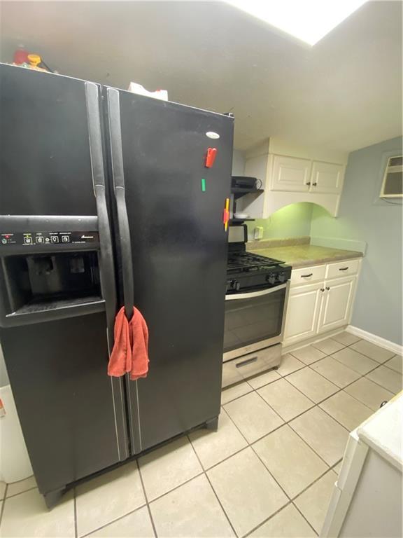 140 Line Street Buford, GA 30518 - Photo 26 of 31 a kitchen with stainless steel appliances a stove a refrigerator and a counter top