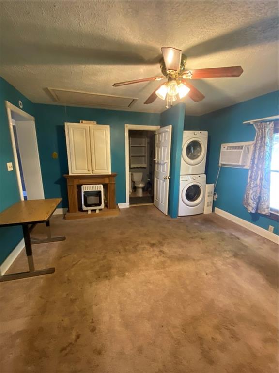 140 Line Street Buford, GA 30518 - Photo 27 of 31 a view of a livingroom with furniture and a ceiling fan