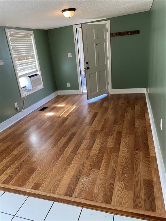 140 Line Street Buford, GA 30518 - Photo 4 of 31 a view of entryway with wooden floor