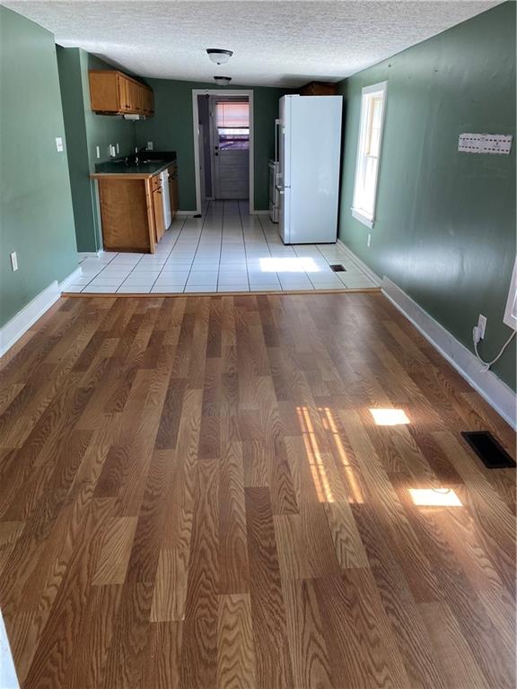 140 Line Street Buford, GA 30518 - Photo 5 of 31 a view of a hallway with wooden floor and stairs