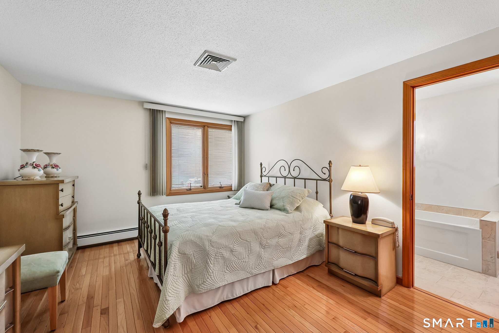 46 Stonegate Drive Wethersfield, CT 06109 - Photo 17 of 36 MAIN FLOOR PRIMARY BEDROOM SUITE