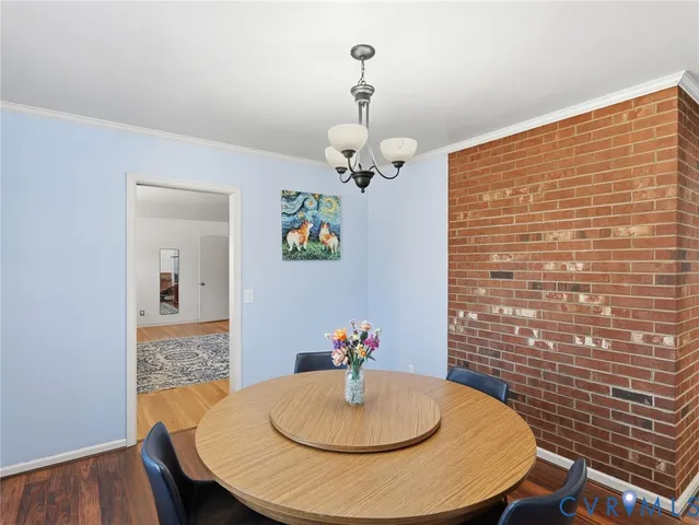 a dining room with table and chairs