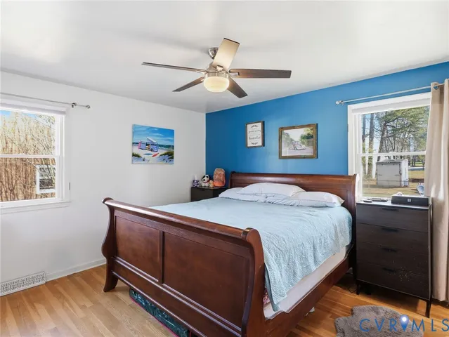 a bedroom with bed and window