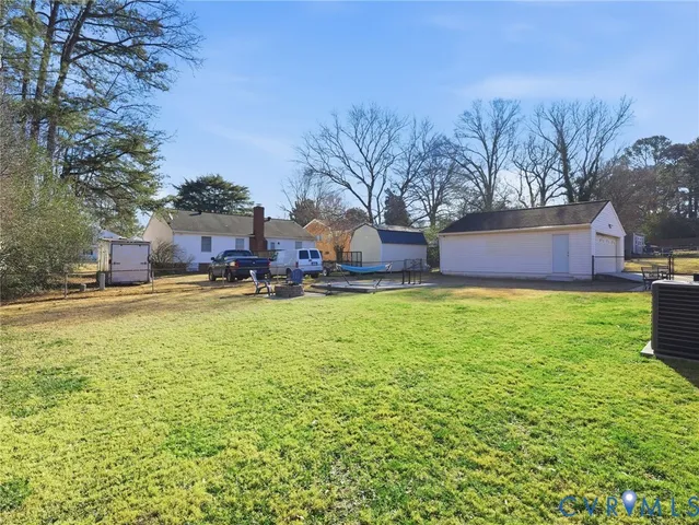 a house view with swimming pool in front of it