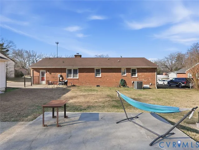a view of a house with wooden fence