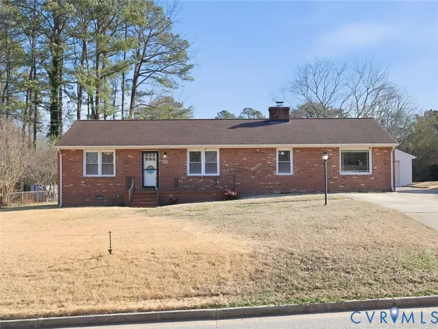 a house that has a tree in front of it