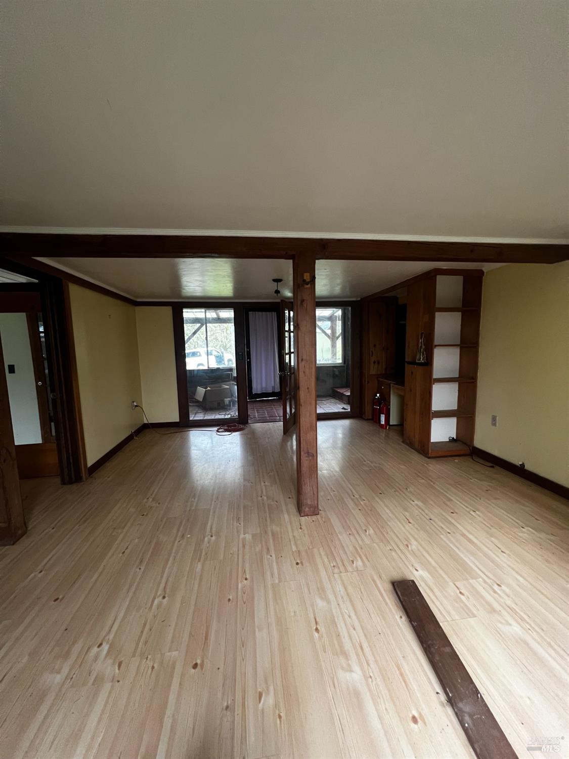 23040 Poonkinney Road Covelo, CA 95428 - Photo 37 of 77 wooden floor in an empty room with a window