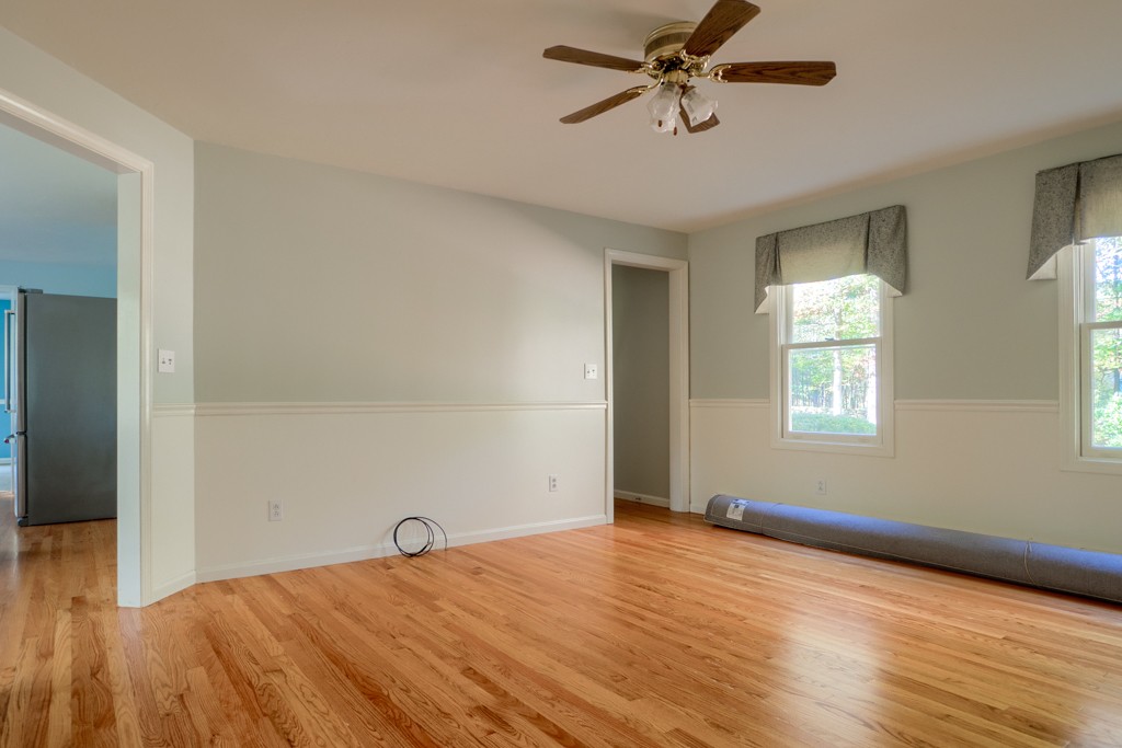 140 Bullard Road Oakham, MA 01068 - Photo 11 of 29 a view of empty room with wooden floor and fan