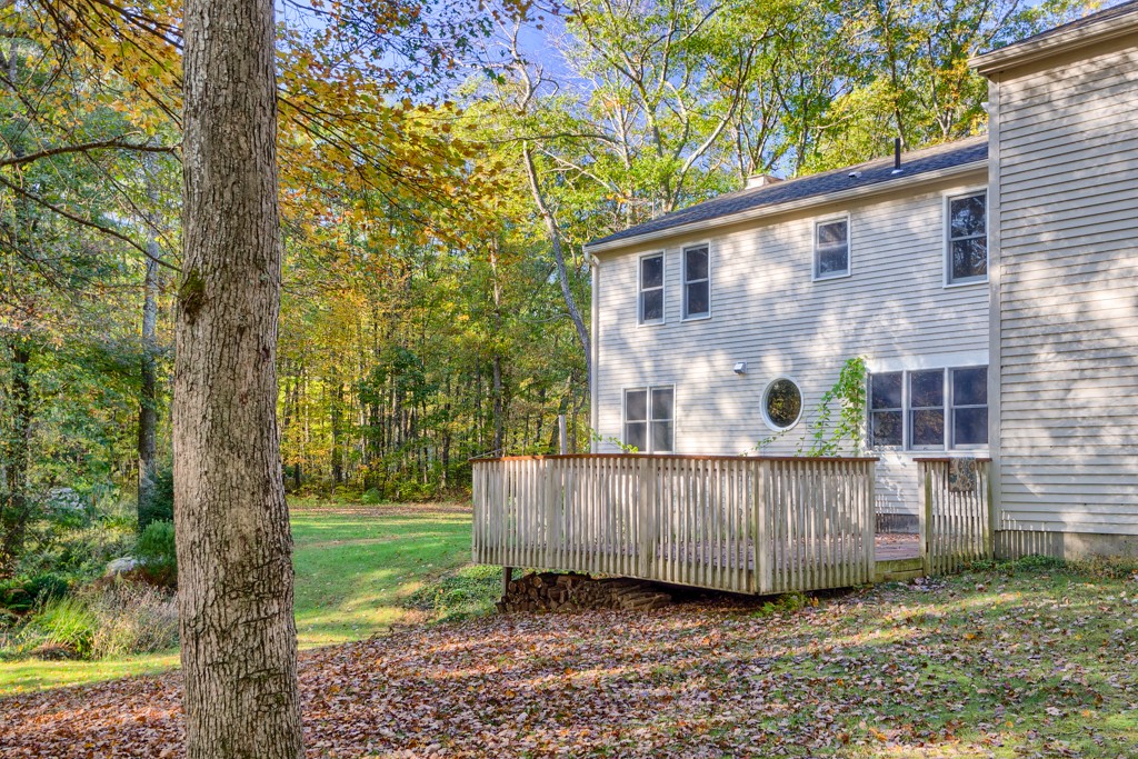 140 Bullard Road Oakham, MA 01068 - Photo 27 of 29 a view of a wooden house with a yard