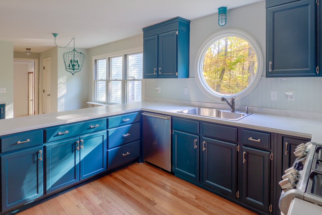 140 Bullard Road Oakham, MA 01068 - Photo 6 of 29 a spacious bathroom with a granite countertop double vanity sink a mirror and window