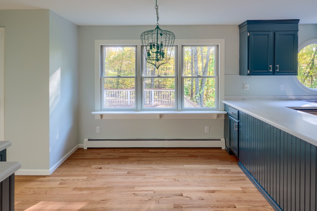 140 Bullard Road Oakham, MA 01068 - Photo 8 of 29 a view of wooden floor and windows in a room