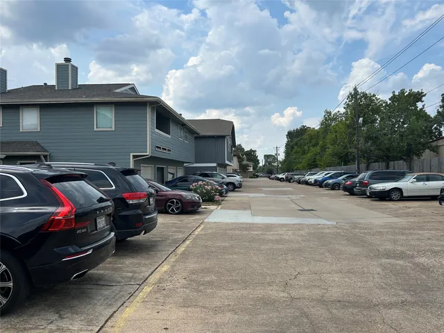 a view of street with parked cars