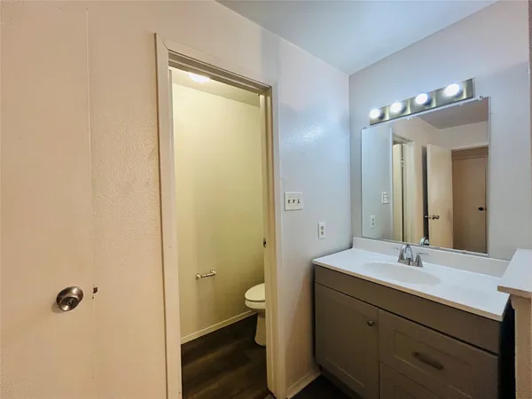 a bathroom with a double vanity sink toilet and shower