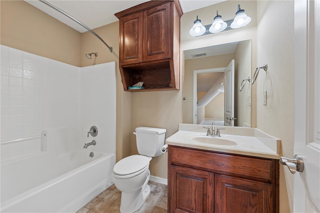403 South Cedar Ridge Circle Robinson, TX 76706 - Photo 15 of 46 a bathroom with a sink vanity granite toilet and shower