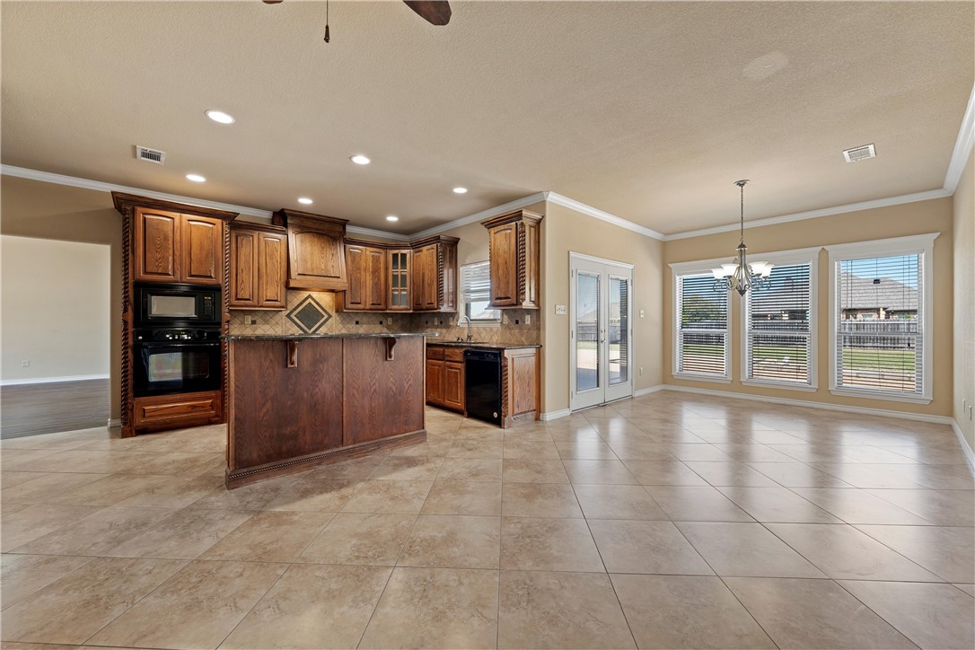 403 South Cedar Ridge Circle Robinson, TX 76706 - Photo 20 of 46 a view of a kitchen with refrigerator and wooden floor