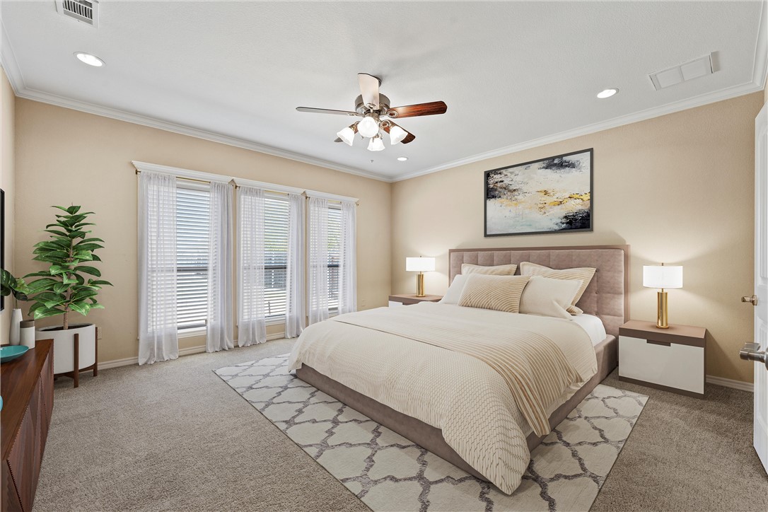 403 South Cedar Ridge Circle Robinson, TX 76706 - Photo 21 of 46 a spacious bedroom with a large bed and a chandelier