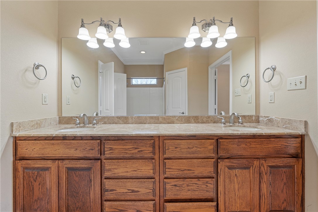 403 South Cedar Ridge Circle Robinson, TX 76706 - Photo 26 of 46 a bathroom with a granite countertop double vanity sink and a mirror
