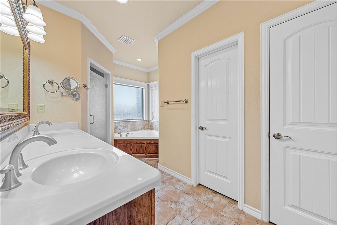 403 South Cedar Ridge Circle Robinson, TX 76706 - Photo 31 of 46 a bathroom with a sink and a mirror