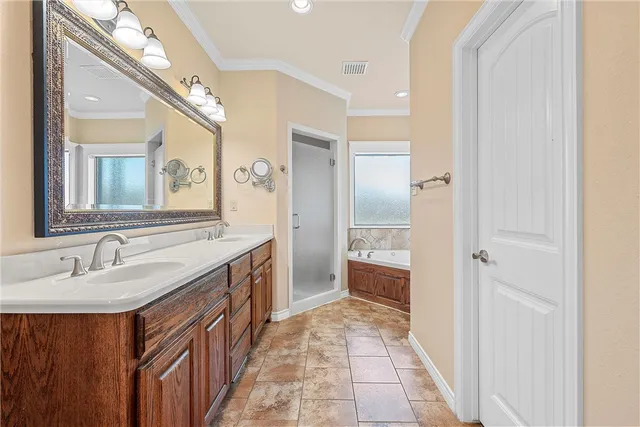 a spacious bathroom with a sink a mirror and a shower