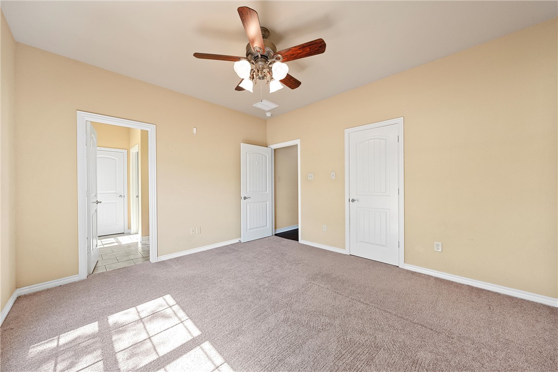 403 South Cedar Ridge Circle Robinson, TX 76706 - Photo 38 of 46 a view of an empty room with a chandelier fan