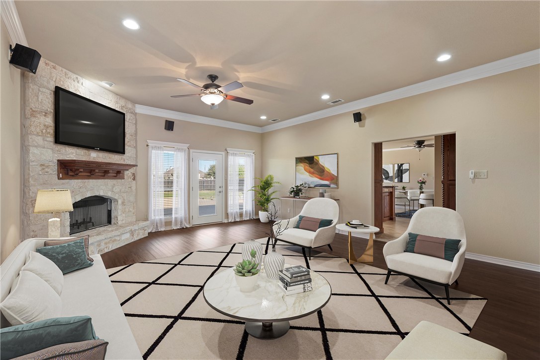403 South Cedar Ridge Circle Robinson, TX 76706 - Photo 8 of 46 a living room with furniture a fireplace and a flat screen tv